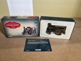an old fashioned model of a steam engine in a box