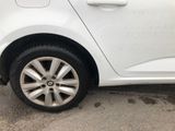a white car that is parked in a parking lot