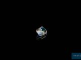 a close up of a diamond on a black surface