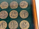 a picture of a picture of a collection of coins in a wooden frame