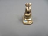 a gold statue of a rabbit with a blue stone in it ' s mouth