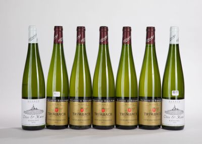 six bottles of wine are lined up in a row