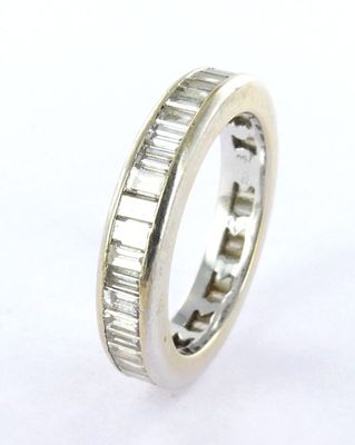 an image of a wedding ring with baguets of diamonds
