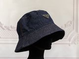 the hat is made of denim and has a leather patch on the front