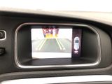 a picture of a car ' s rear view mirror with a car on it