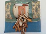 a bag with a bunch of wooden sticks hanging from it