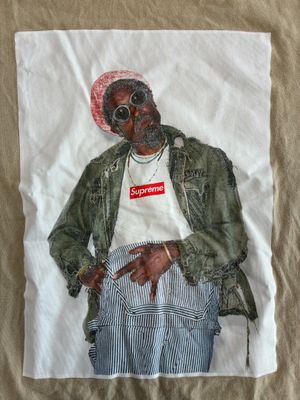 a picture of a t - shirt with a picture of a man wearing a hat and jacket
