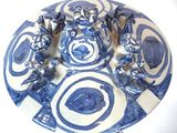 a blue and white plate with a blue and white design on it