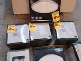 several boxes of electronics are sitting on the floor next to a cardboard box