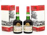 two bottles of castleton ' s irish whiskey sitting next to each other