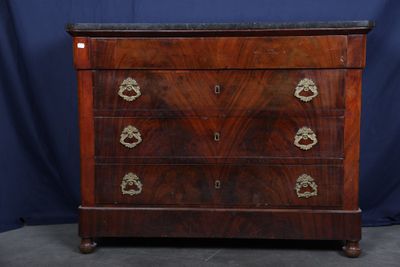 an antique chest of drawers with a marble top and brass handles