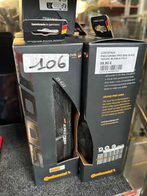 two boxes of tires on display in a store for sale