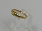 a close up of a gold ring with a diamond on top of it