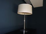 a lamp that is on top of a black table