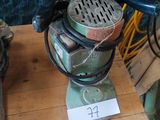 a small machine that is sitting on a wooden table