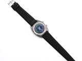 an image of a watch with a black strap on a white surface