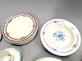 many plates that are sitting on a table