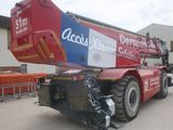 a large crane that is parked in front of a building