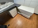 an image of a desk with a computer on top of it