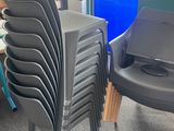 a lot of chairs that are sitting in a room