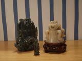 two figurines that are sitting on a table