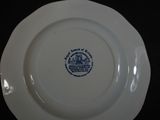 a white plate with a blue and white design on it