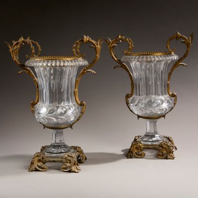 pair of antique glass vases with gold accents on stands
