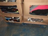 a cardboard box with several pairs of shoes inside of it