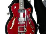 a red electric guitar in a case on a white background