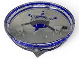 mirrored tray with a blue and white design on the bottom