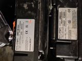 two batteries in the back of a car