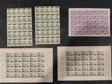 four different stamps are on top of each other on a table