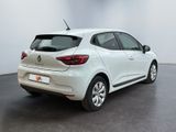 the rear end of a white car parked in a white room