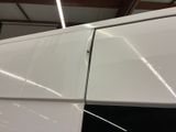 a close up of a white refrigerator in a kitchen