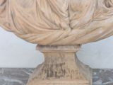 a statue of a woman laying down on a pedestal