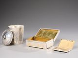 a silver box with a silver lid and a silver container with a silver lid and a silver container with a silver lid and a silver container with a silver