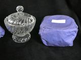 three pieces of glass are sitting on a black cloth