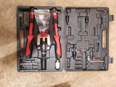 a tool kit in a plastic case on the floor