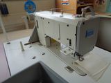 an image of a sewing machine in a room