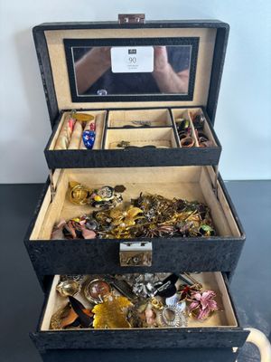 a black box filled with assorted items on a table