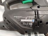 an image of a corded jig saw on a white surface