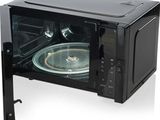 un four à micro-ondes noir muni d'une porte en verre