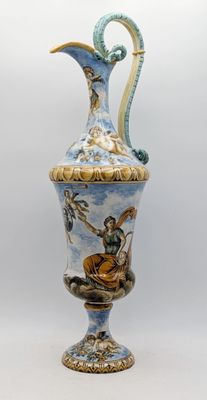 a blue and white vase with a painting on it