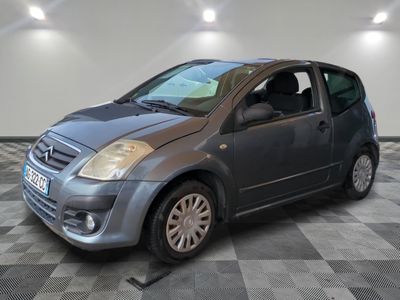 a picture of a small car parked in a garage