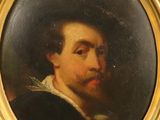 portrait d'un homme barbu dans un cadre en or