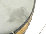 a close up of a drum with a rope on it