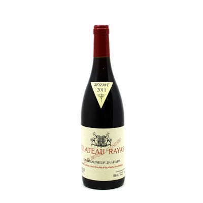 the bottle of wine is sitting on a white surface