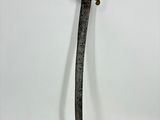 a close up of a knife on a white surface with a white background