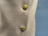 a close up of a jacket with buttons on it