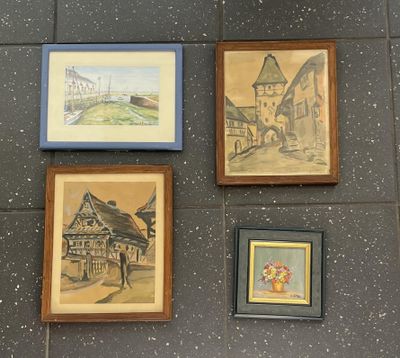 four framed pictures on the wall of a building